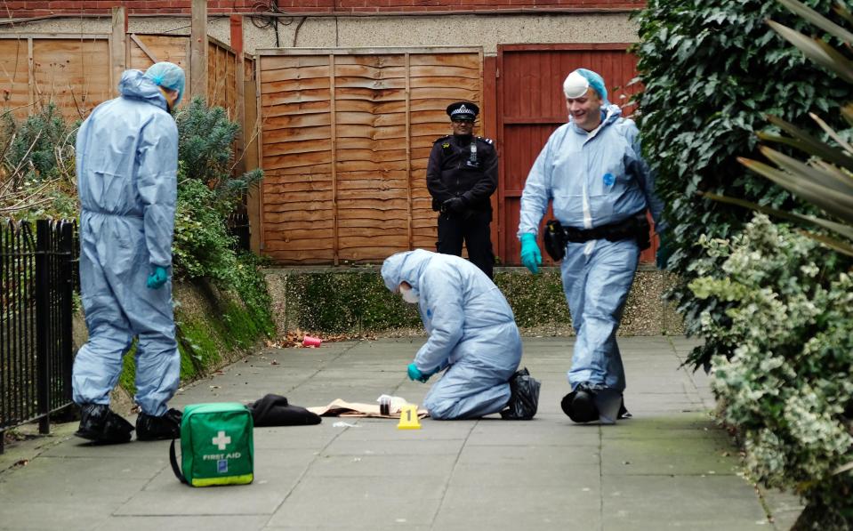 Forensic officers scour the area where tragic Steven was knifed to death