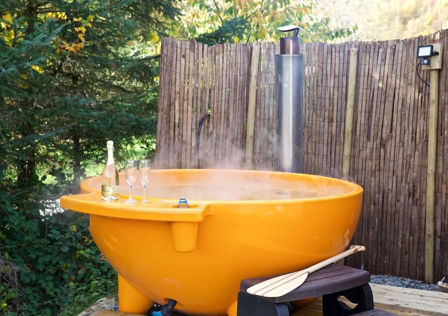 Each dome at Loch Tay Highland Lodges is furnished with a wood burning stove and external fire pit - and some even have their own outdoor hot tub