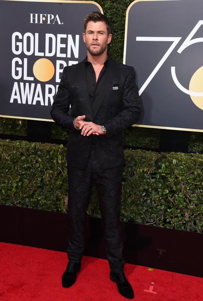  Chris Hemsworth cut a dapper figure in an all-black, fitted suit