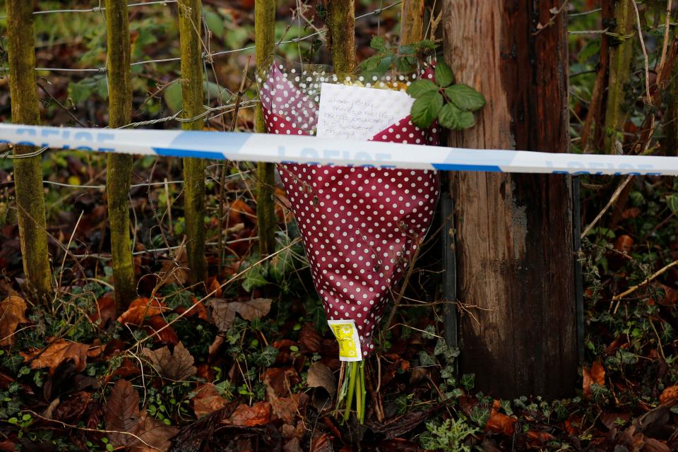 Flowers are left at the scene after the community was left in shock