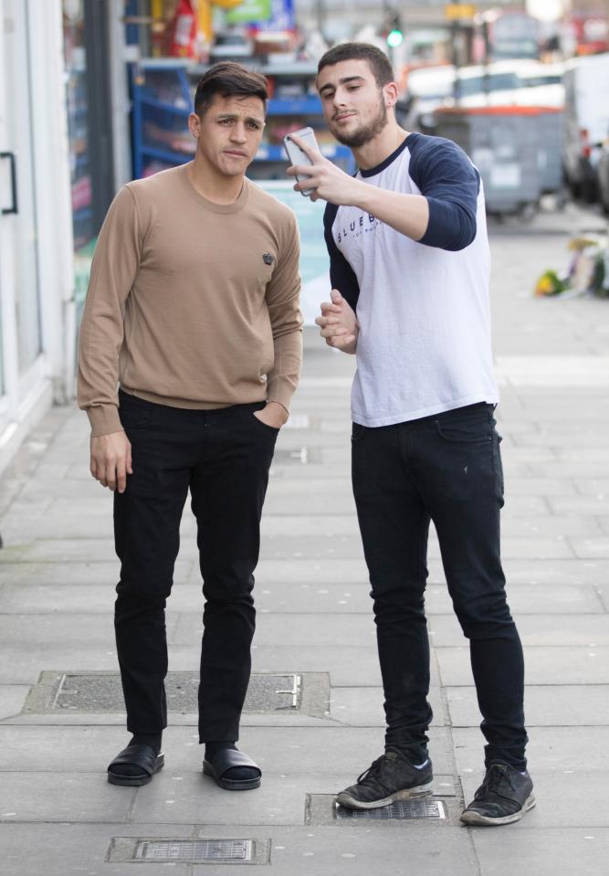 Alexis Sanchez patrolled the streets in socks and sandals as he mulls his future, as he looks set to join Man United