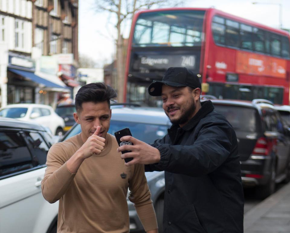 Alexis Sanchez still took the time to take pictures with fans, despite the Gunner being all-but a goner