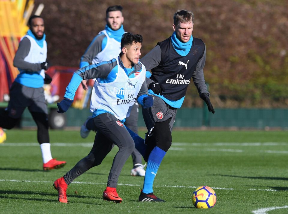Alexis Sanchez with Per Mertesacker during Arsenal training