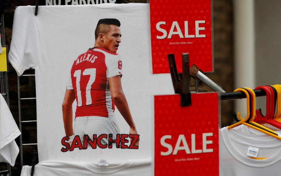  Alexis Sanchez T-shirts on the sale rail outside the Emirates