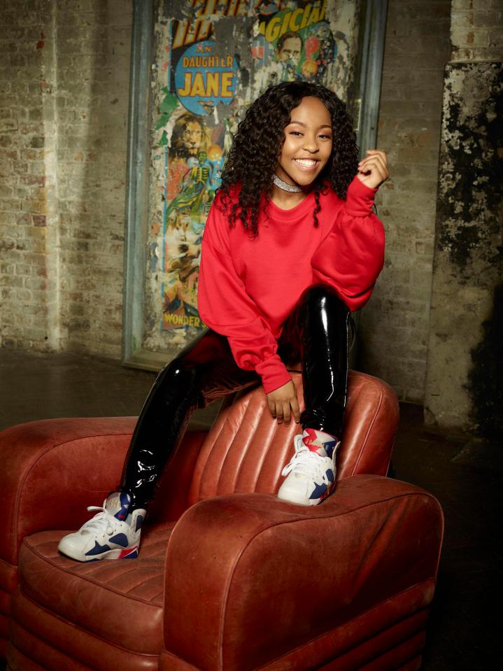 Asanda in red top and leggings