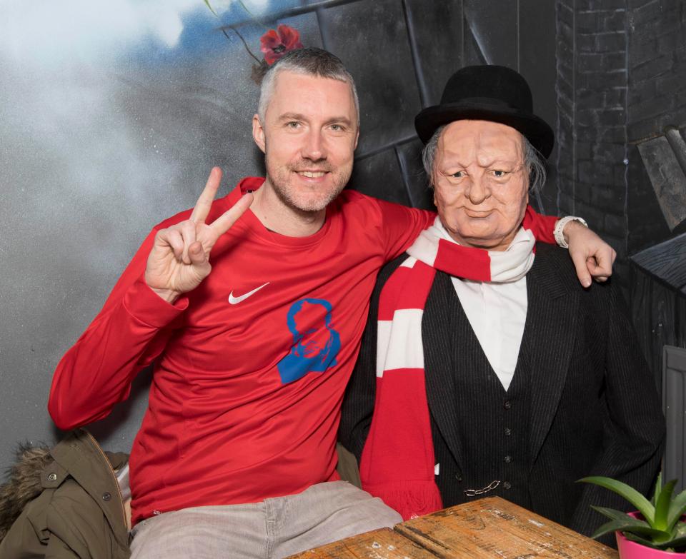 Cafe owner Chris Evans stands outside his Winston Churchill theme Blighty cafe