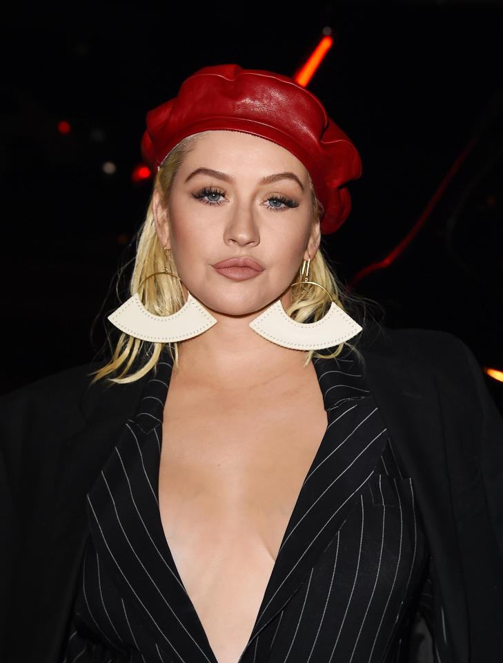 Christina Aguilera seems to be paying homage to two of her heroes – Prince and EastEnder Pat Butcher