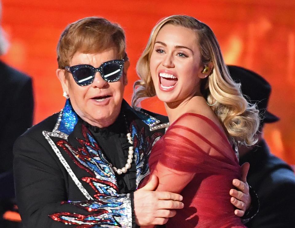 Sir Elton John and Miley Cyrus on stage together at the 60th Annual Grammy Awards