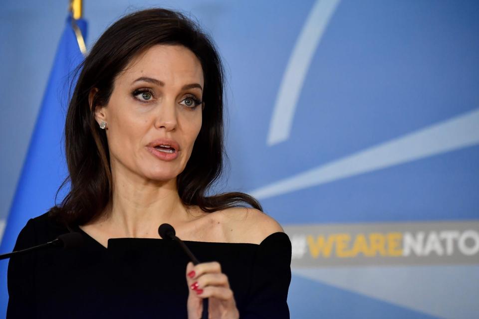 UNHCR Special Envoy Angelina Jolie gives a press conference after a meeting between representatives of the NATO and the the UN Refugee Agency