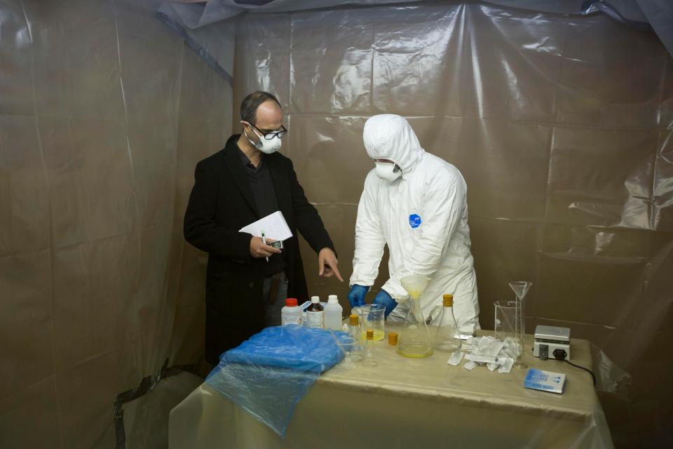  Inside an illegal steroid lab in the West Midlands. The man who makes the steroids dressed in the white suit