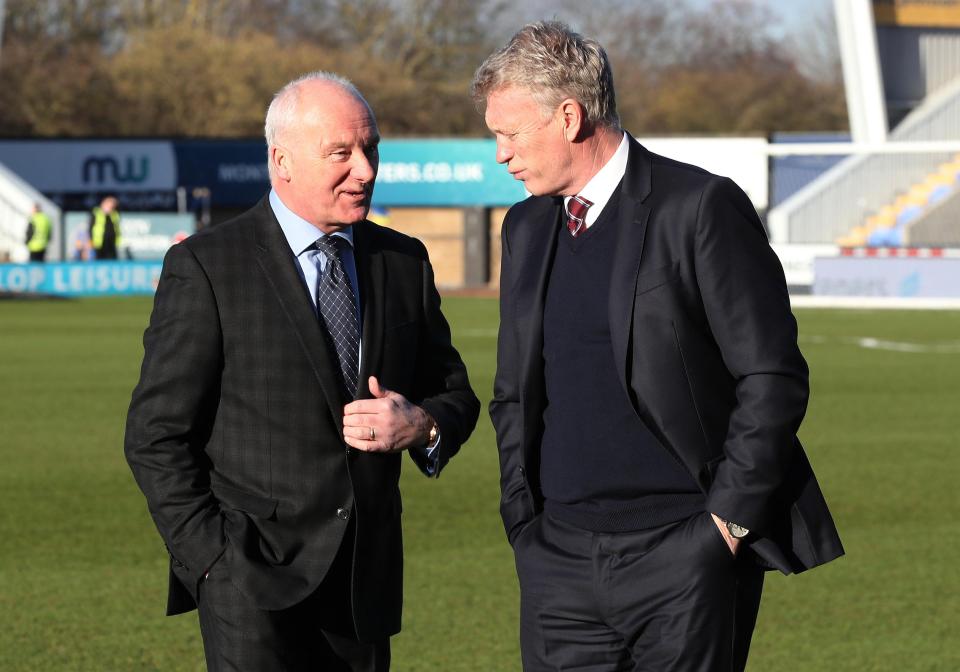 Tony Henry, pictured here with Hammers boss David Moyes, has been axed by the Premier League club