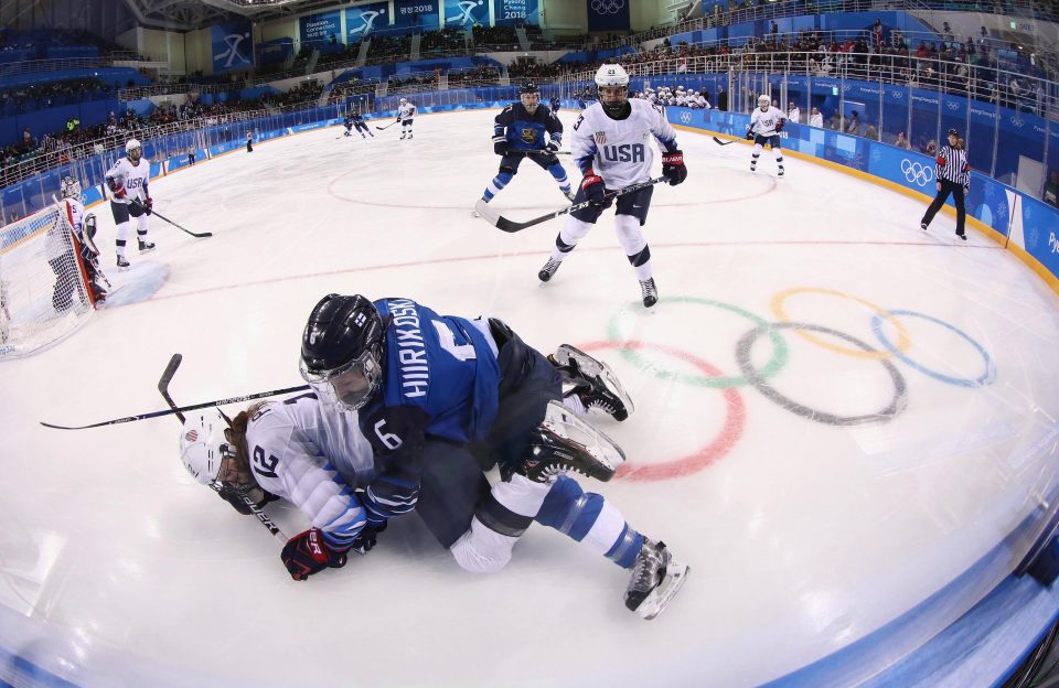  Finnish star Jenni Hiirikowski falls on top of Kelly Pannek during the match