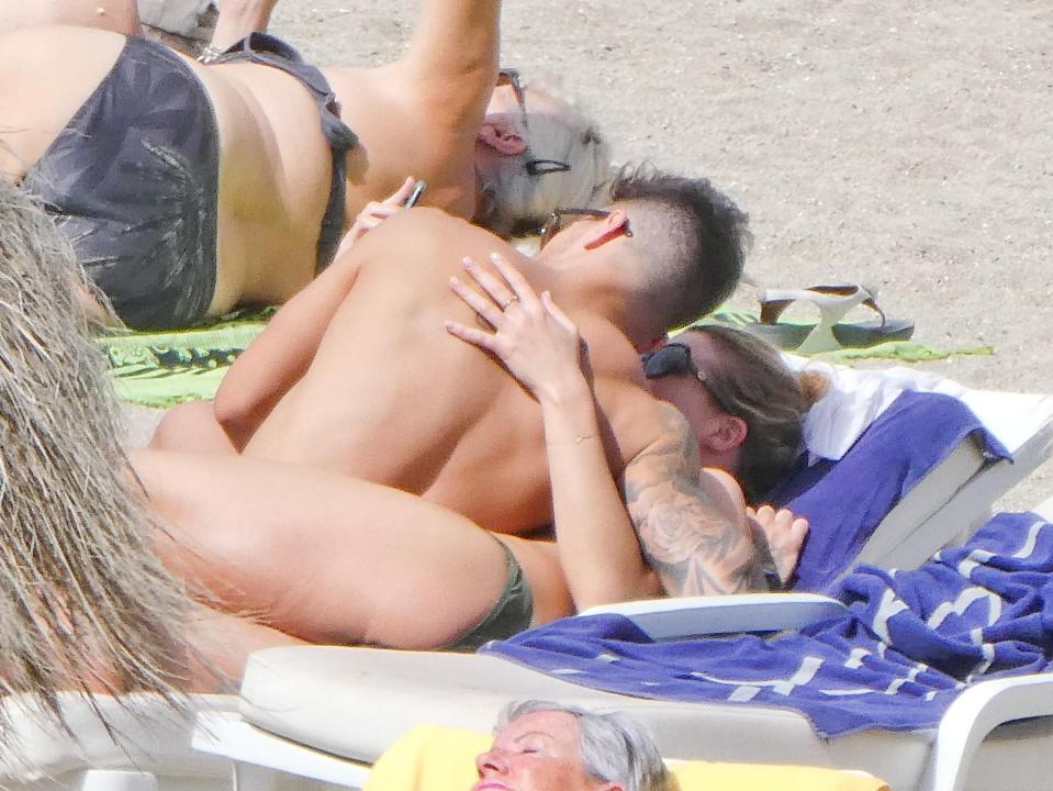  The pair were very touchy-feely as they soaked up the sun