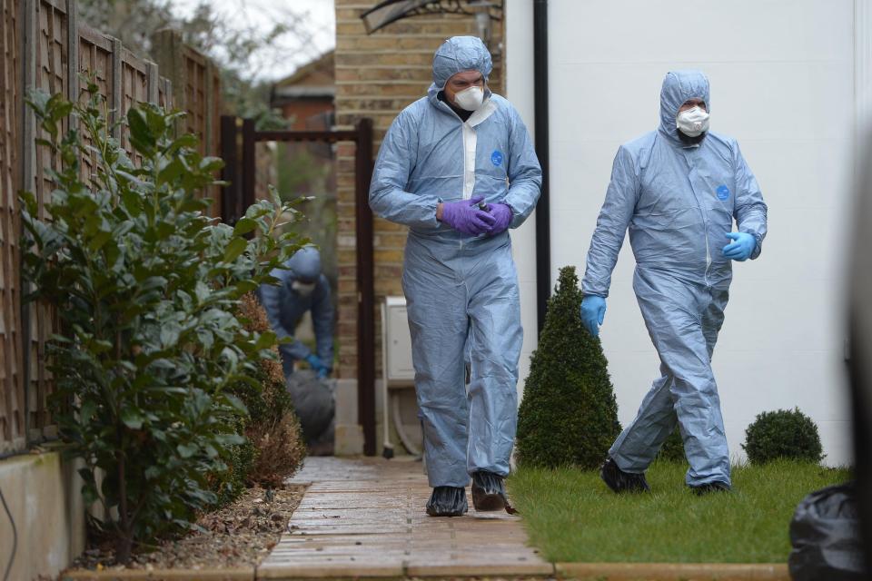  Forensics team work at property in Twickenham where body of 47-year-old woman was found