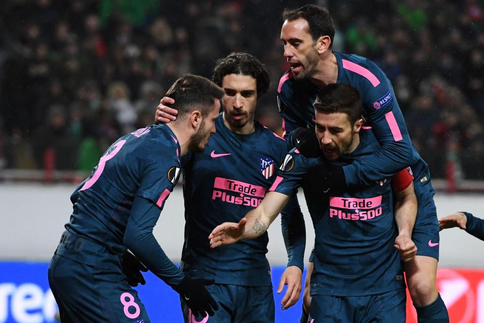 Atletico Madrid's players celebrate the team's second goal scored by Saul Niguez 