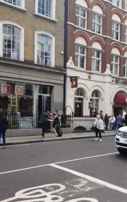  The pedestrian initially kicked out at the man