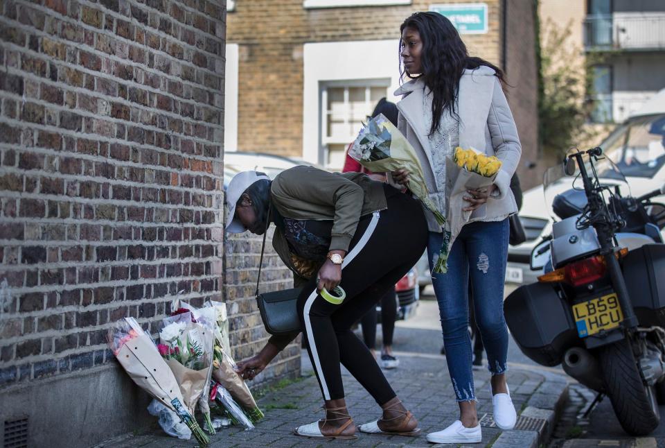  People lay flowers in tribute to the killed teenager