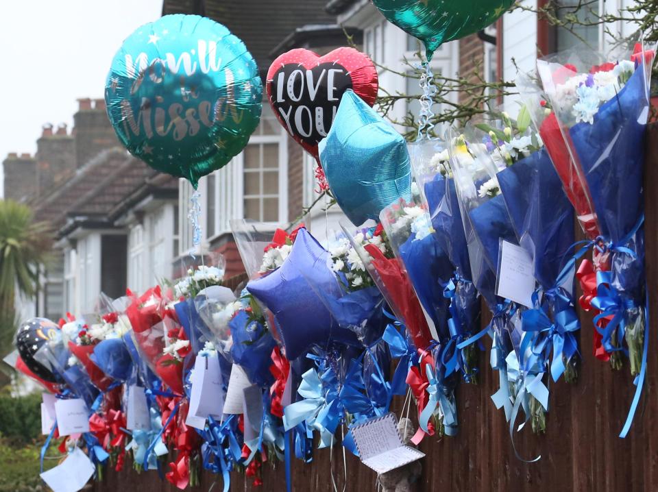  People were pictured laying flowers and tying these balloons near Richard's home - before they were torn down twice