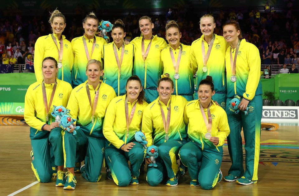  Silver medallists Australia pose during the medal ceremony after narrowly missing out on gold