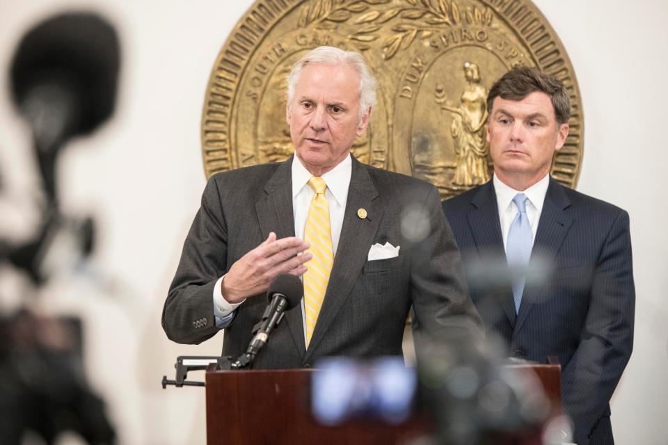South Carolina Gov. Henry McMaster, left with Bryan Striling, 