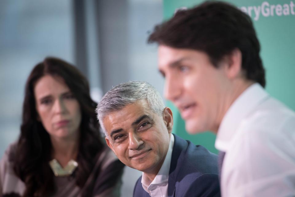  Mr Khan looking at Mr Trudeau while he spoke