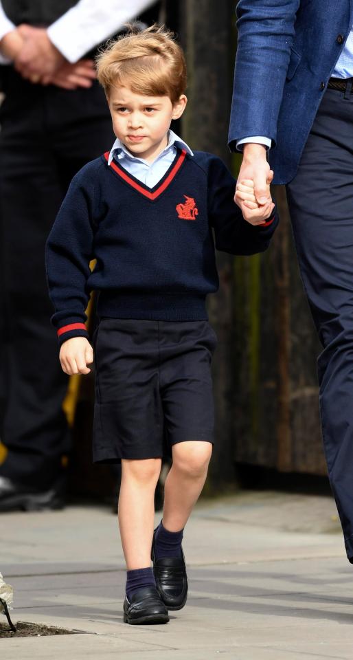 Dressed in school uniform Prince George appeared more weary of the paps 