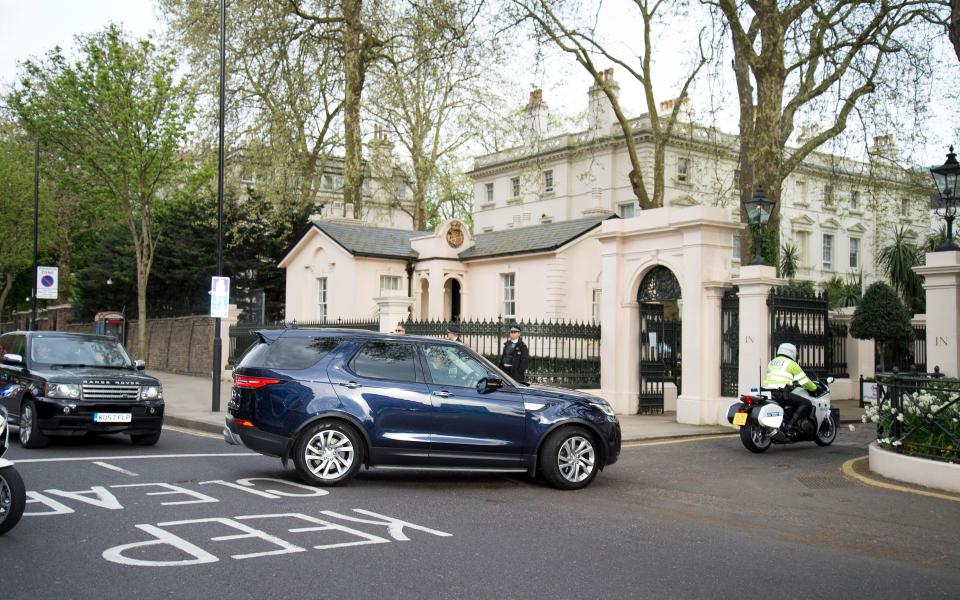 The royal car enters the grounds of Kensington Palace carrying Prince William, Kate and their baby boy