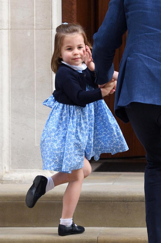 The Princess gives an adorable wave to the press