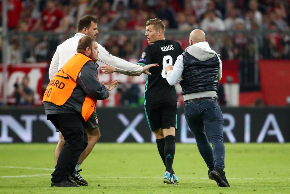 Another fan made a desperate attempt to get to Real Madrid's German midfielder Toni Kroos