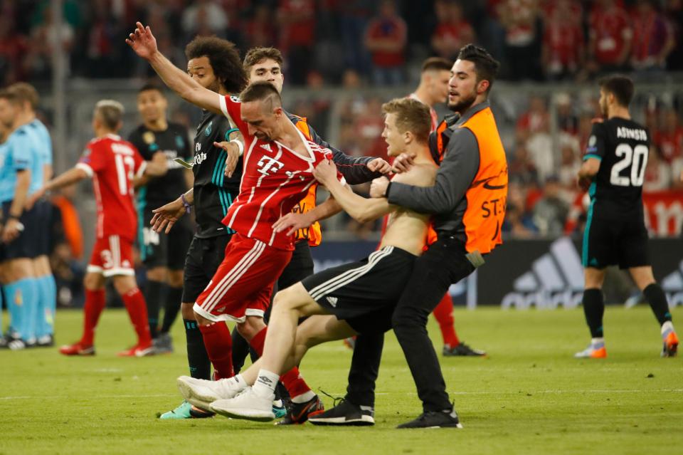 Bayern Munich winger Franck Ribery was the object of some particular rough attention from one shirtless fan