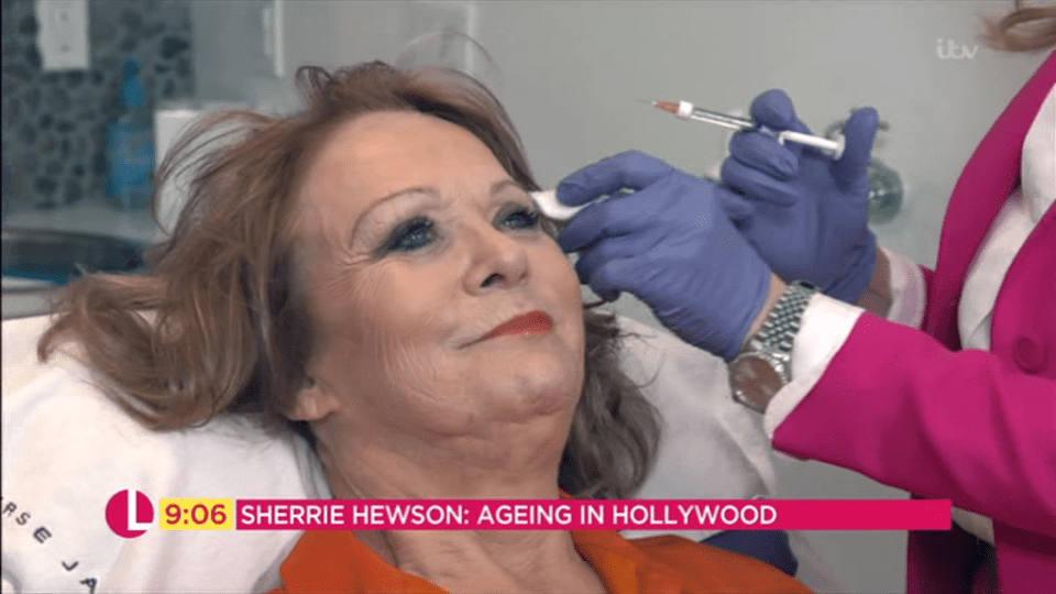  Sherrie kept a brave face as she was injected
