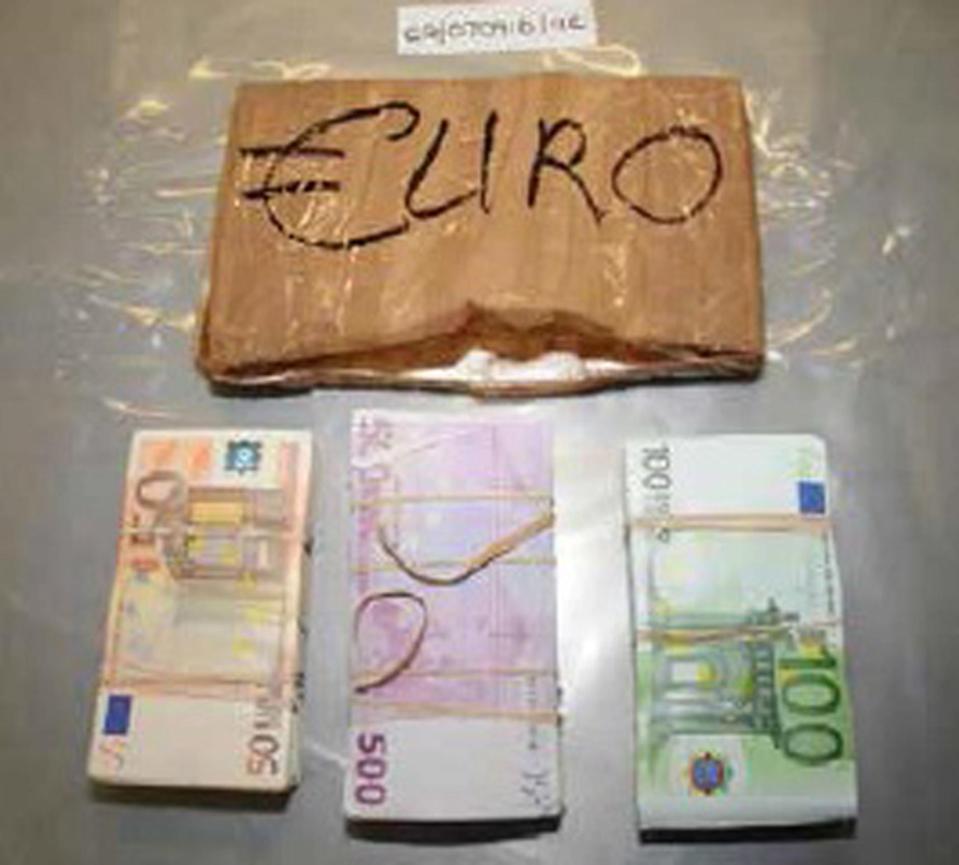  Cops seized cash from five gang members who were jailed for a total of 100 years