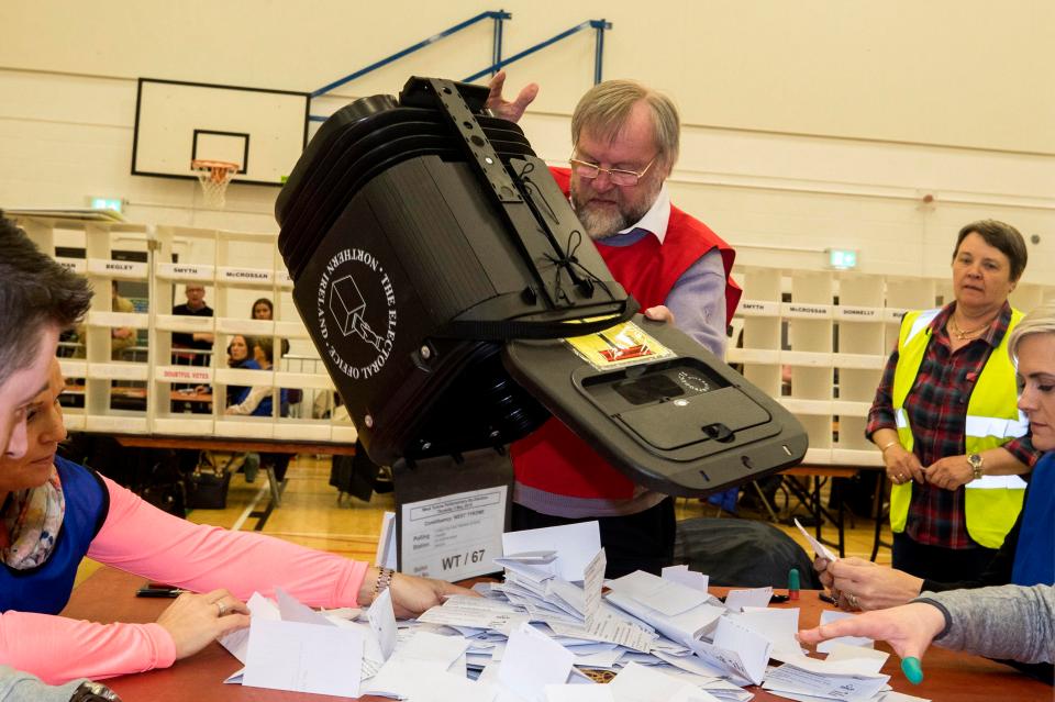  Election staff count ballot papers at Omagh Leisure Complex for the West Tyrone Westminster by-election