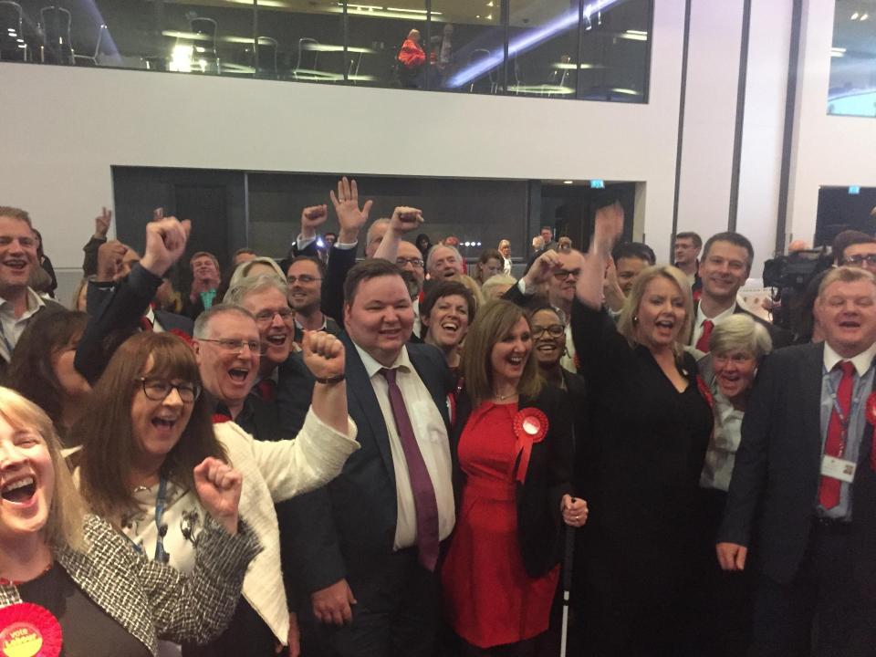  Labour campaigners celebrating after they beat the Tories in Trafford