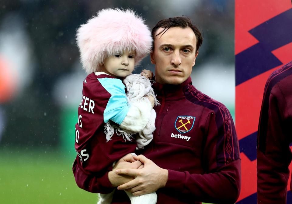  Isla, with skipper Mark Noble, was a mascot for West Ham's match with Bournemouth in January