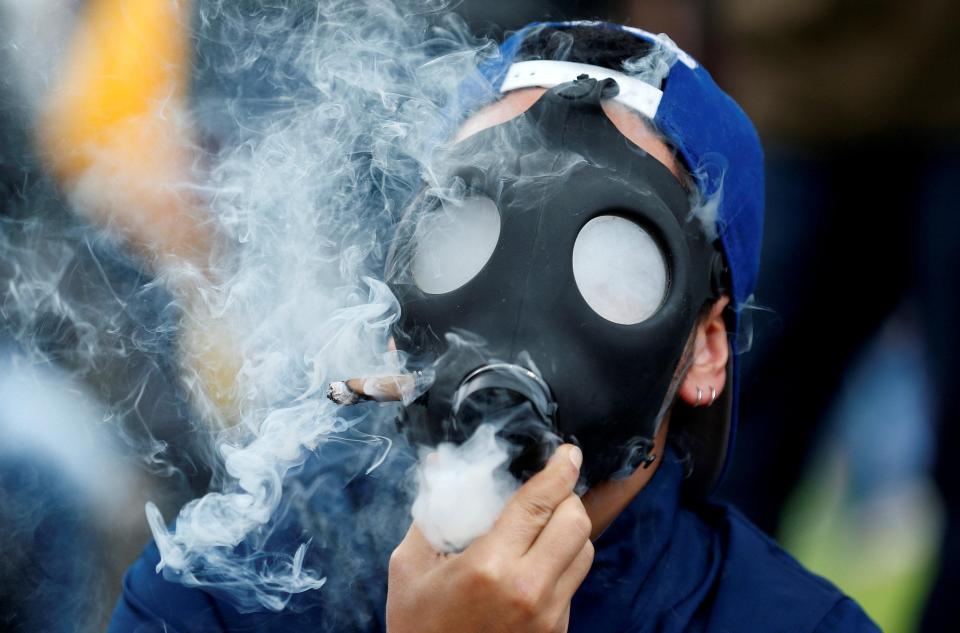  One activist filled up a gas mask to get his high as others called for a change to marijuana laws