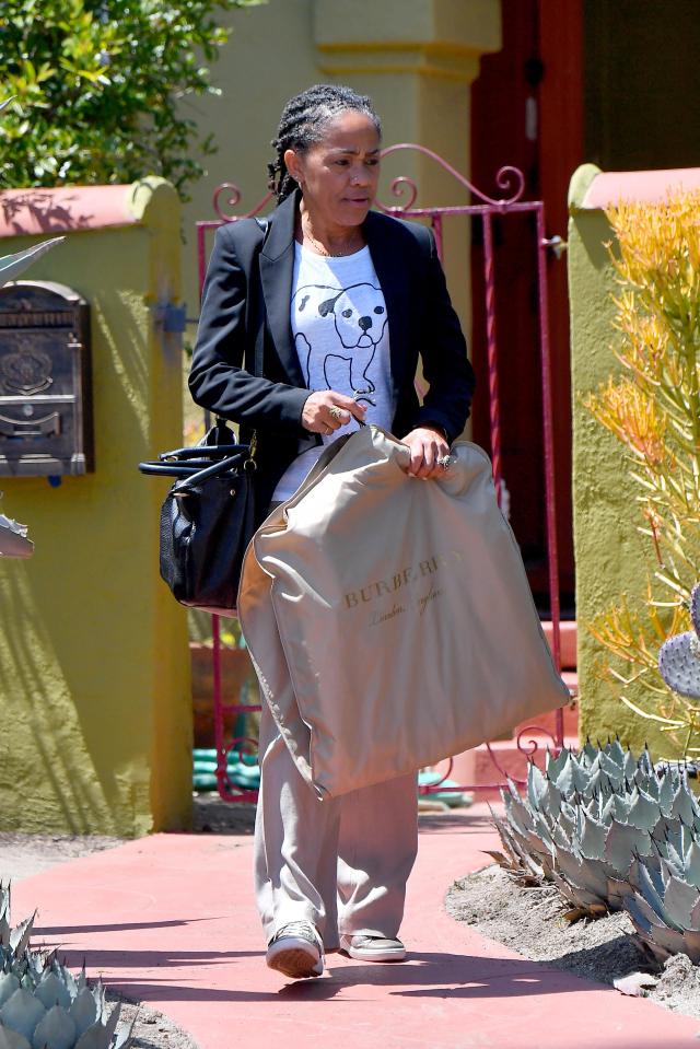 Meghan's mum Doria, pictured leaving her home in LA earlier this week, had been tipped to walk her daughter down the aisle before Prince Charles was confirmed