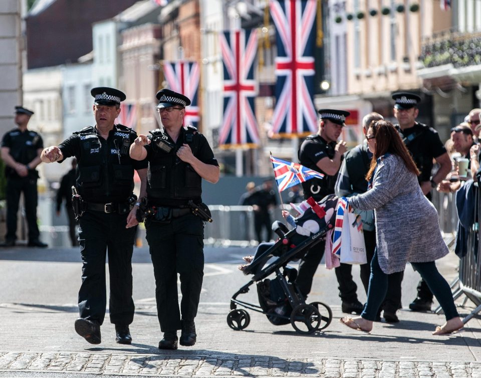 Two officers walk through Windsor, with the security operation the biggest in Thames Valley Police's history