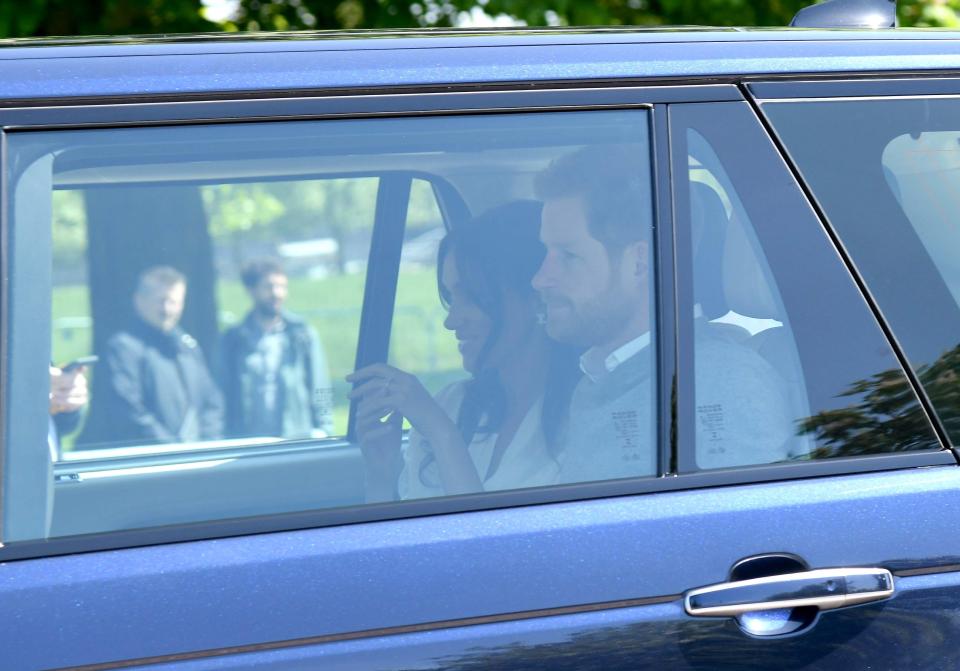  Meghan smiled as she and Harry were driven to Windsor this afternoon
