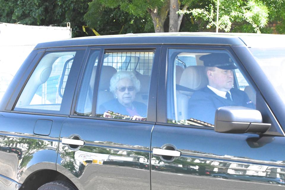 The Queen looks rather solemn-faced as she leaves London this afternoon bound for Windsor Castle in readiness for Prince Harry and Meghan Markle's wedding