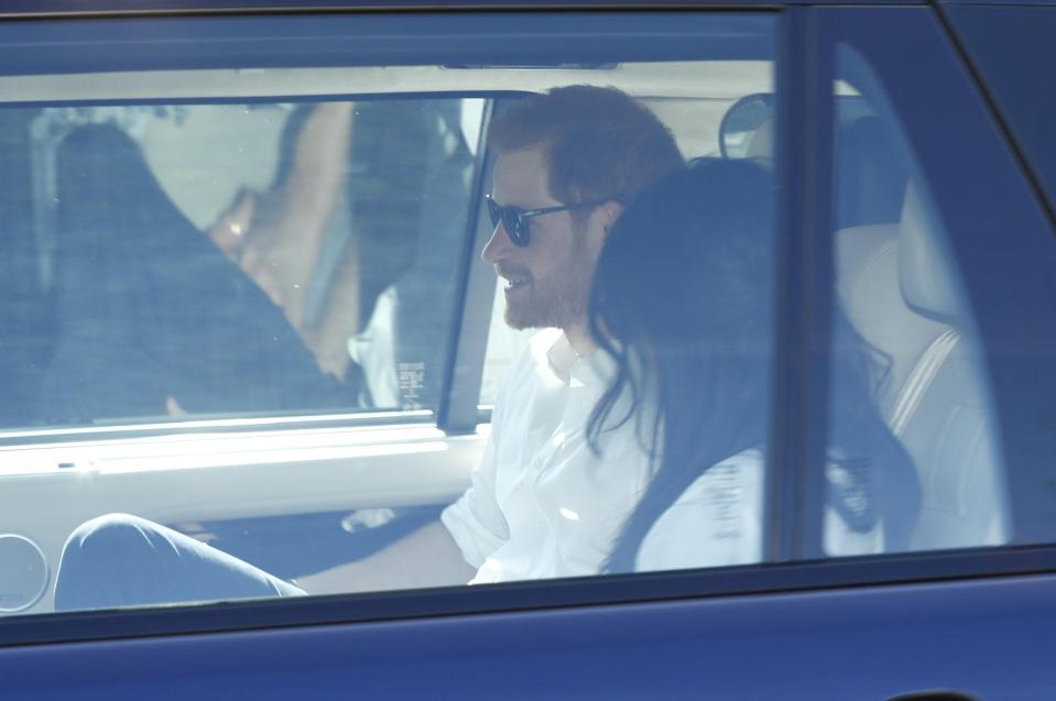  The loved-up couple were driven out of Windsor in matching white shirts and shades