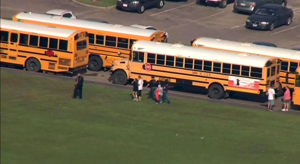  Students are shown outside the Texas school after being evacuated