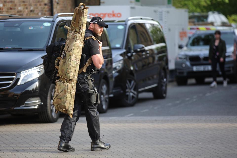  Police snipers were also spotted hauling their gear into position