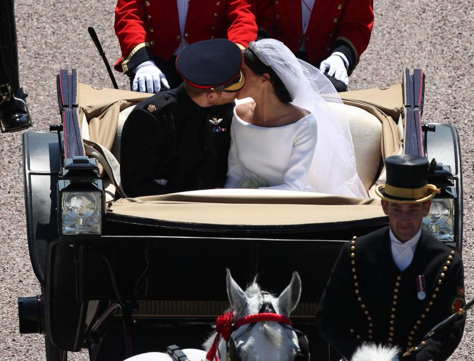 The couple locked lips for a second time as they were taken around Windsor after their gorgeous ceremony