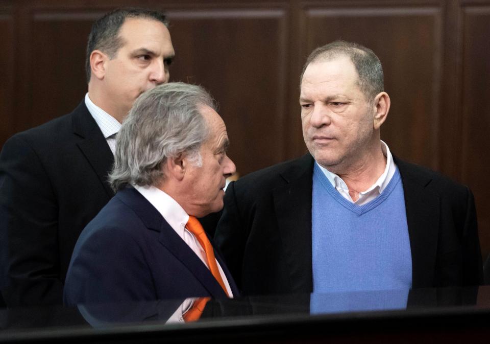 Weinstein conversing with his lawyer, Benjamin Brafman
