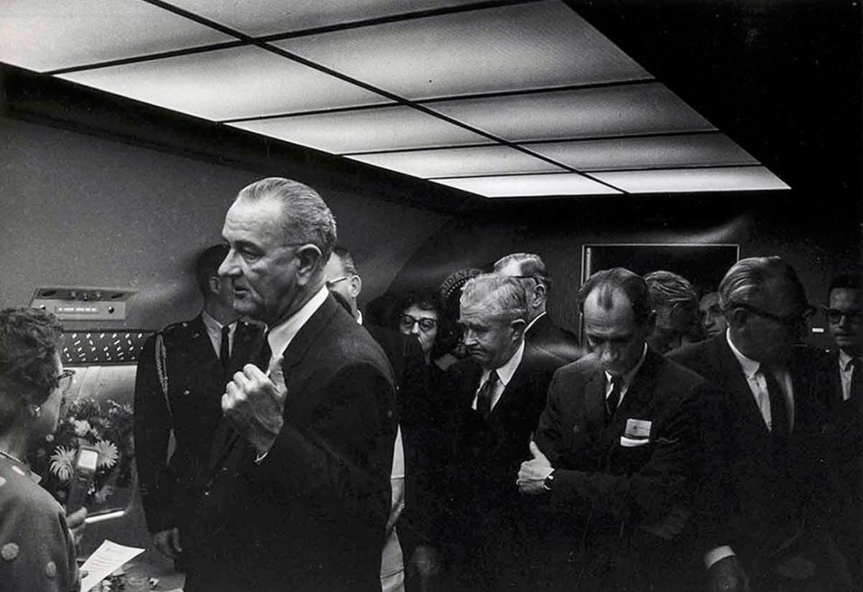 Earlier the vice president and other officials are pictured deep in conversation as they await the arrival of Jackie