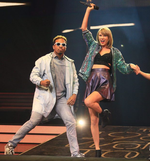 Swift with Toshi, right, performing in Shangai, China, as part of her 1989 tour, in 2015