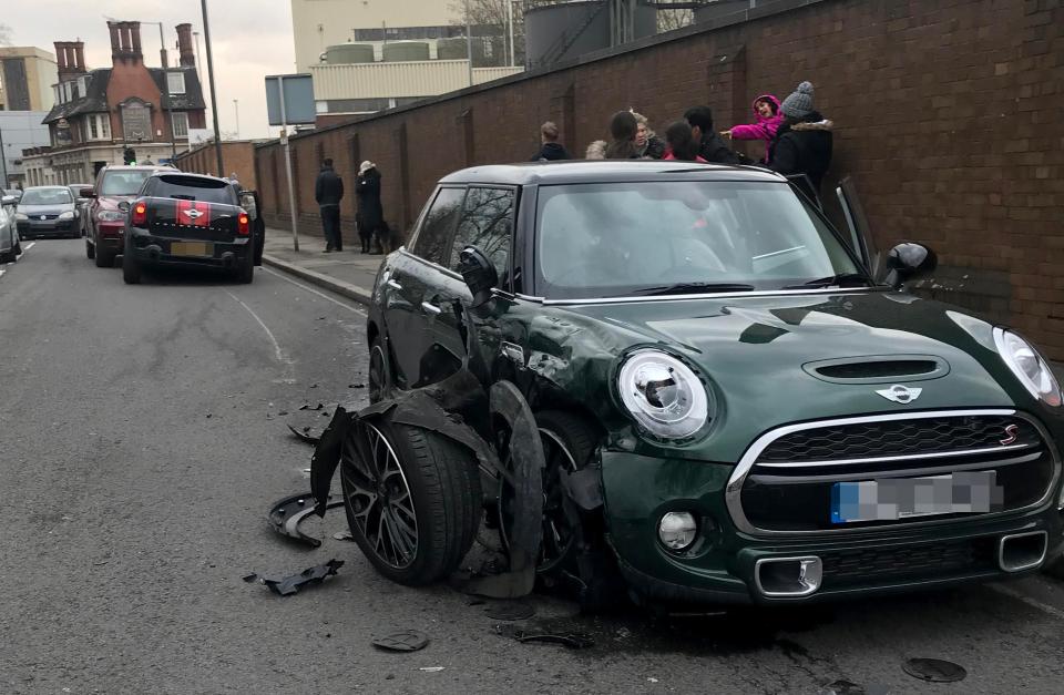 Ant's badly damaged car in the background and the green Mini he hit