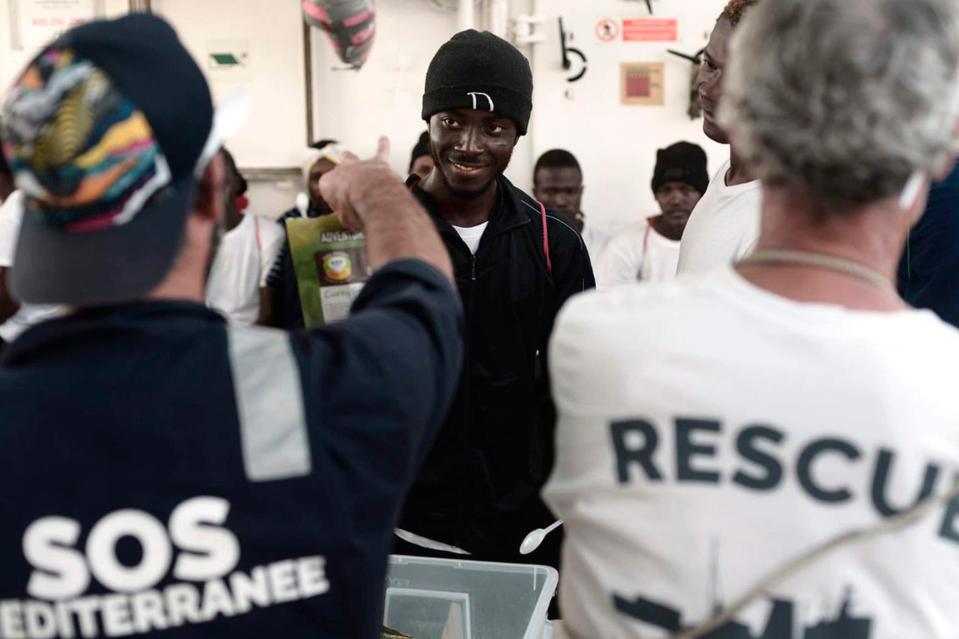 Humanitarian workers risked a mutiny when they told migrants why they had remained at sea for three days