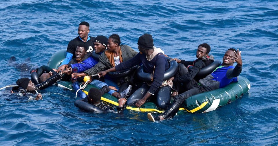  Migrants in small inflatable in the Straits of Gibraltar before being picked up by the Tarifa rescue boat
